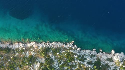 Aerial View of Clear Turquoise Water Near the Rocky Coast of the Aegean Sea