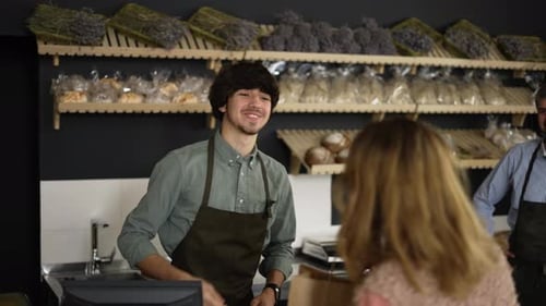 Bakery Worker Serving Customer in a Small Business