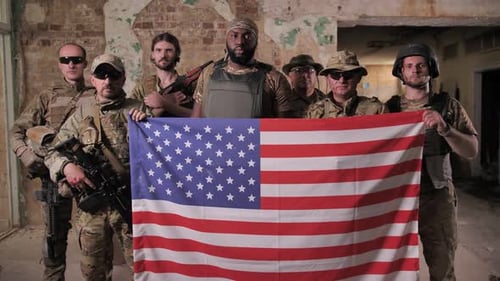 Armed Soldiers Hold American Flag in Derelict Building