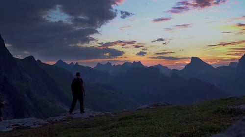 Hikers Enjoying Mountain Sunset Scenery