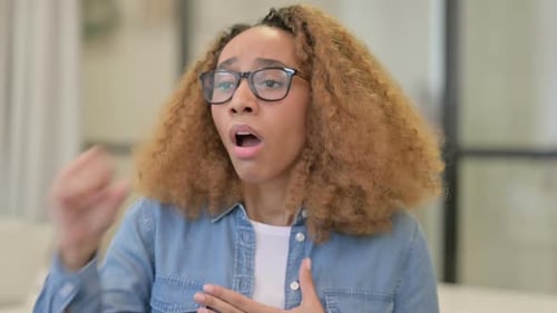 Young Woman Coughing Indoors Close Up