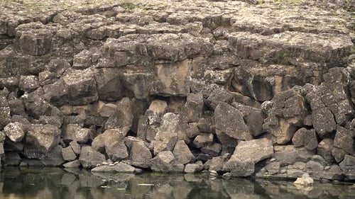 Jagged Rocks by Calm Lake
