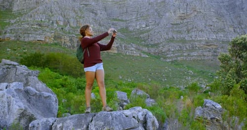 Woman Hiker Photographing Mountain View