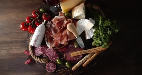 Appetizing Charcuterie Board with Wine and Meats