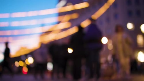 Blurred Lights and Crowds in City