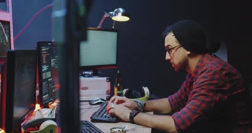 Young Adults Coding at Computers in Urban Workplace