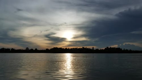 Timelapse of lake with cloud sunset