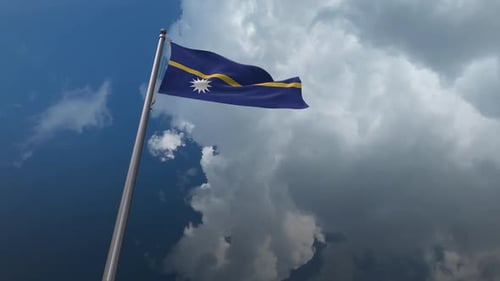 Nauru Flag Waving on Flagpole with Dynamic Sky Background