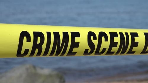 Crime Scene Tape At Beach Location