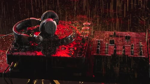 Professional Console Deck Turntable and Headphones in a Dark Studio. Raindrops Fall on the