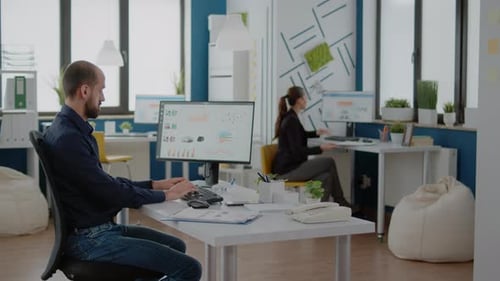 Corporate Employee Working on Data Charts Design