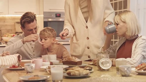 Family Enjoys Breakfast Together at Home