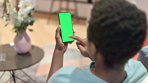 Holding Smartphone with Green Screen Display