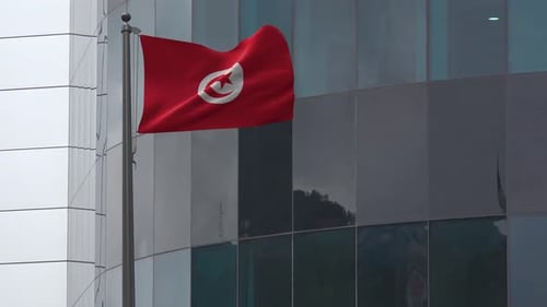 Waving Tunisia Flag in Front of Modern Building