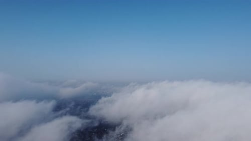 High Above the Thick Fog Like Beautiful Ocean of Clouds at Sunrise
