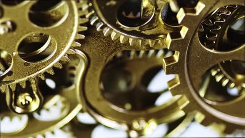 Golden Gears Turning in Intricate Mechanism Close-Up