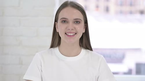 Smiling Young Woman Posing Indoors Close-Up
