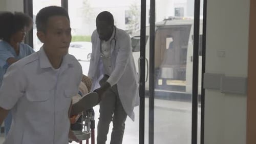 Medical Staff Rushing Patient on Gurney in Hospital