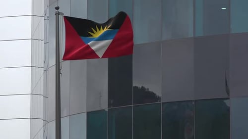 Antigua And Barbuda Flag Waving In Front Of Modern Building