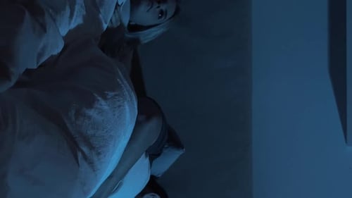 Couple Sleeping Peacefully in Bed at Night