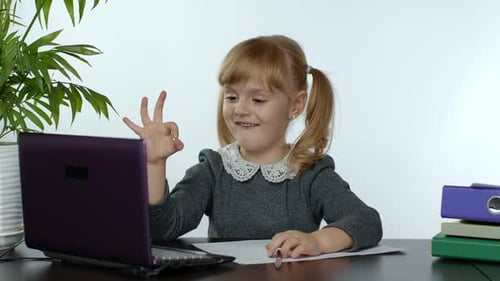 Smiling Girl Video Calling on Laptop