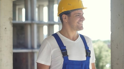 Construction worker on a sky background