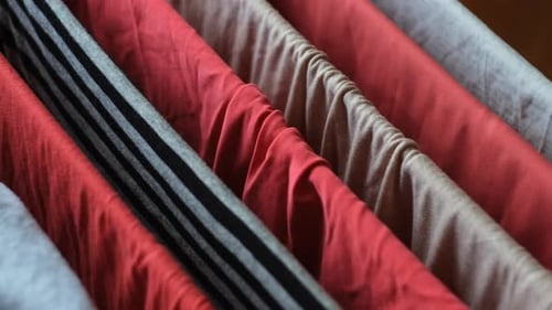 Folded Clothes on a Drying Rack Close Up