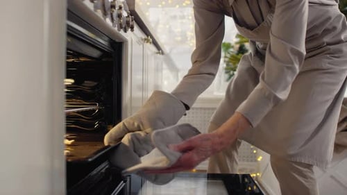 Senior and Child Baking Christmas Cookies Together