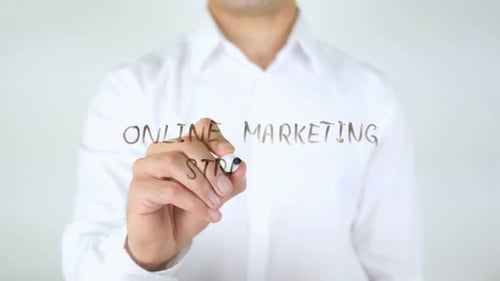 Writing Online Marketing Strategy on Clear Surface