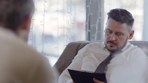 Businessmen Discussing Documents