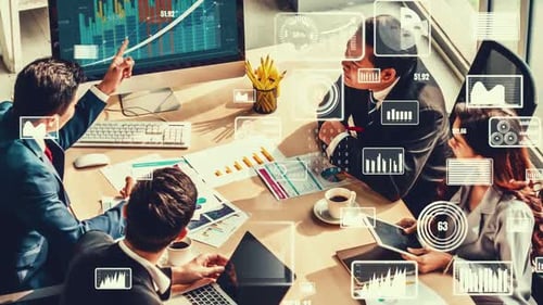 Business People Discussing Charts and Graphs at Meeting