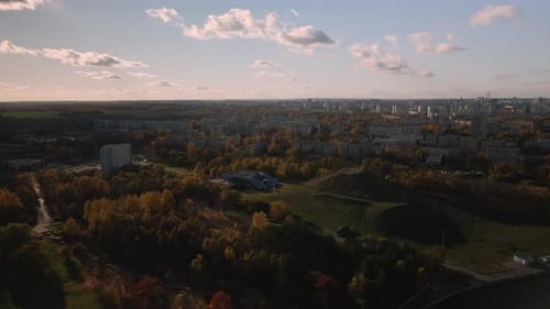 Flight over the autumn park. Trees with yellow autumn leaves are visible.
