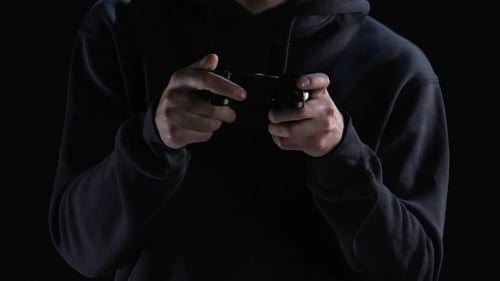 Holding Video Game Controller in Dark Room