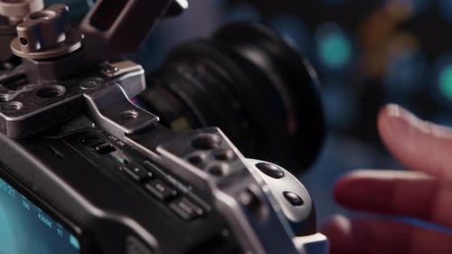 Closeup of the Videographer's Hand Adjusting the Focus on Camcorder