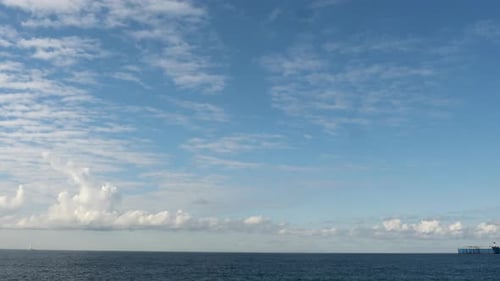 Timelapse Footage of Clouds Floating Over the Sea