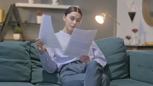 Woman Celebrates Good News at Home