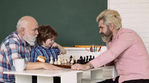 Three Generations Enjoying a Chess Game Together