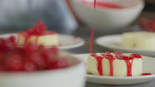 Dessert Being Prepared with Red Currant Topping