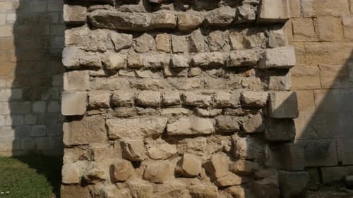 Ancient castle protecting wall cross-section with lot of rock levels 4K 2160p 30fps UltraHD titlitn