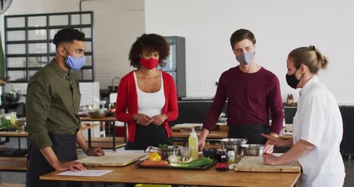 Young Adults Learn Cooking Skills Wearing Face Masks