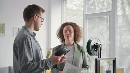 Young Talented Male and Female Engineers are Using Modern Technology and Discussing Plastic for a 3D