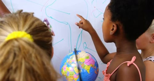 Young Students Learn Geography in Classroom Setting