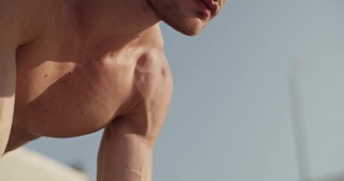 Muscular Man Doing Calisthenics on Parallel Bars