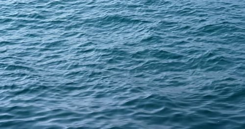 Blue Ocean Water Surface Ripples in Daylight