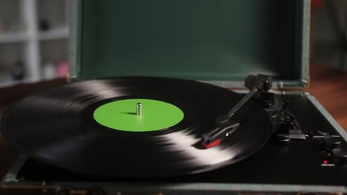 Vinyl Record Spinning on a Portable Record Player