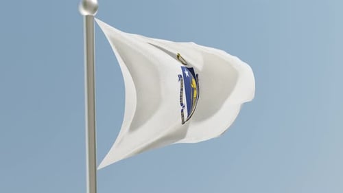 Massachusetts State Flag Waving on Flagpole Against Blue Sky