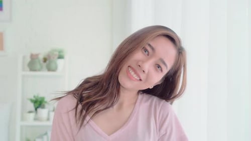 Smiling Woman Poses in Bright Home Interior