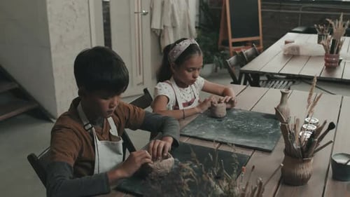 Children Creating Pottery in Art Studio