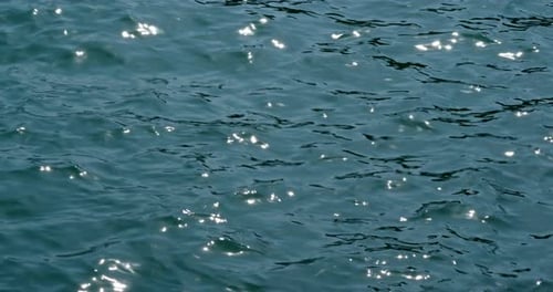 Sea surface water with sunlight sparkle