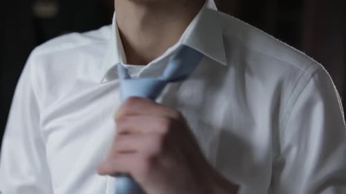 Handsome Groom Fixes His Blue Bow Tie. Wedding Morning